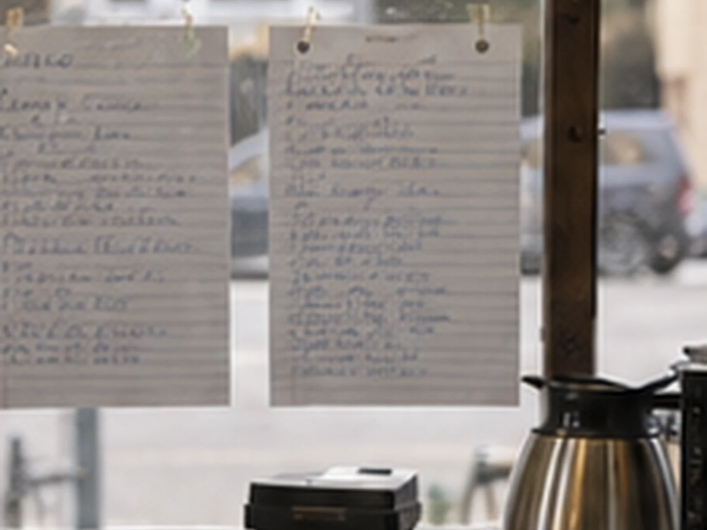 Handwritten grouse sheet taped to cafe glass