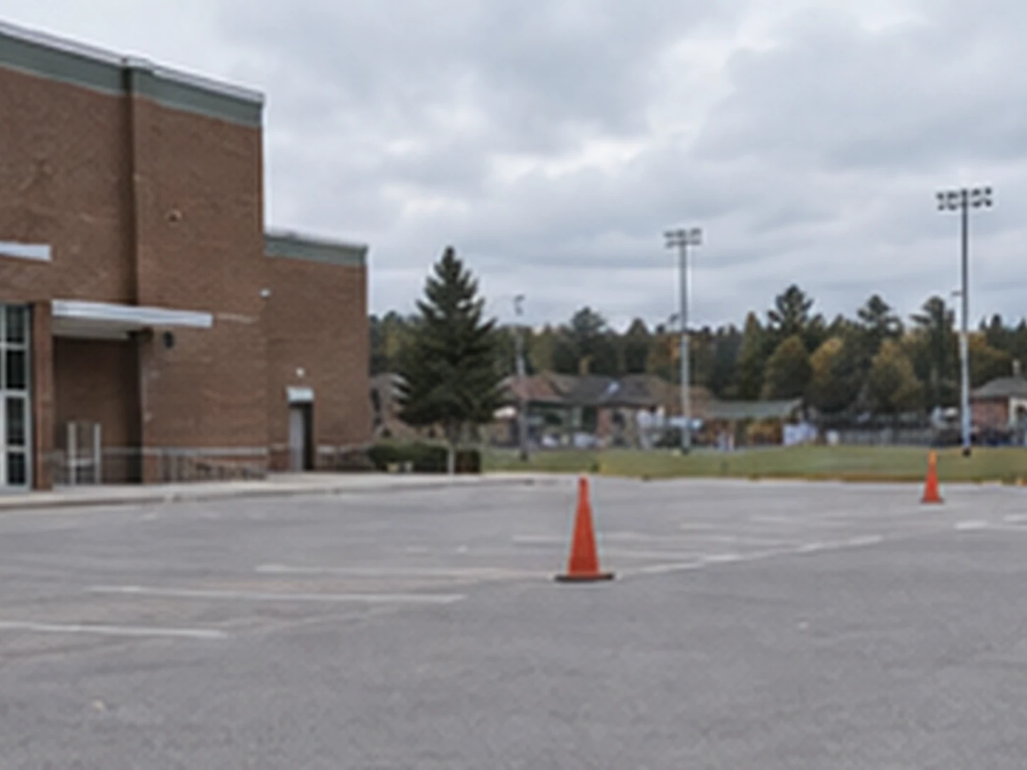 Lakeside school parking lot with gym and field approaches